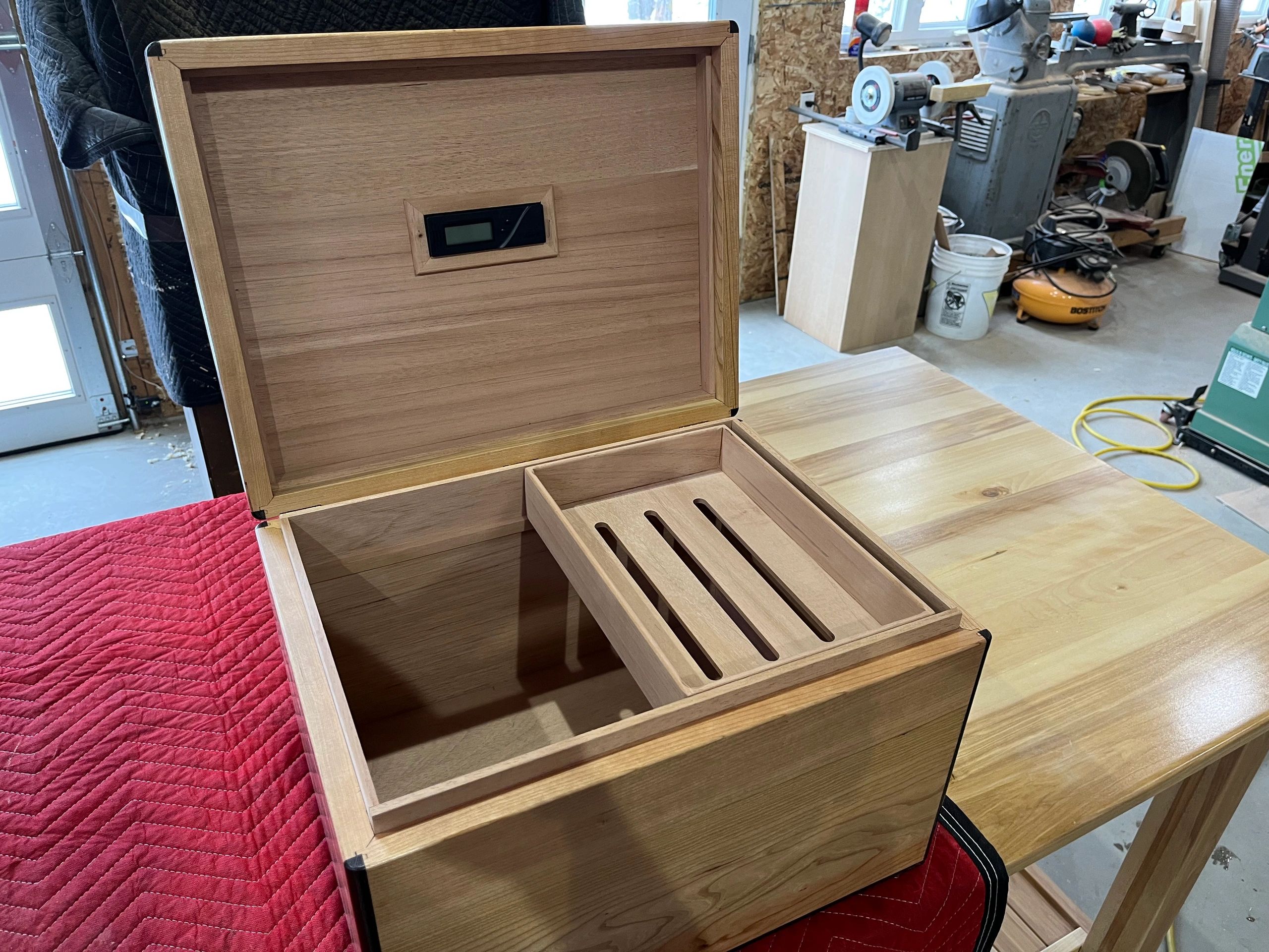 150 count birds eye maple and ebony humidor. Handcrafted with a book matched hand cut veneer top.